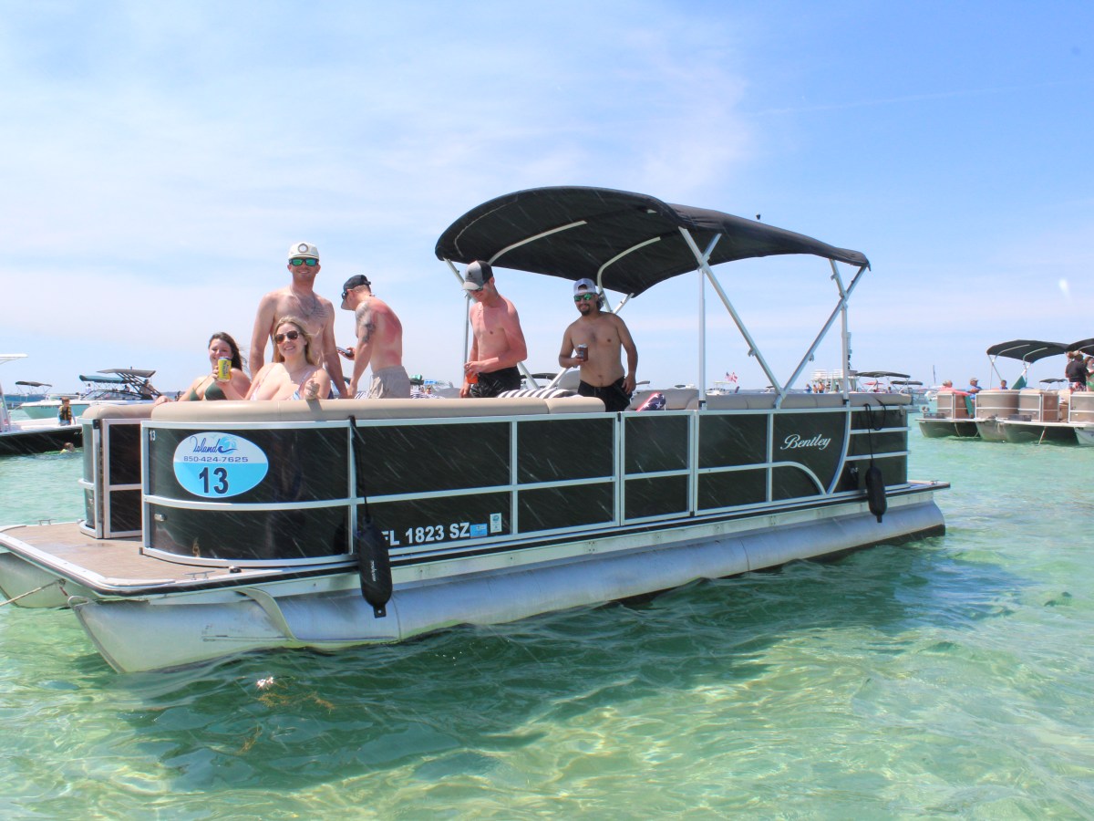 a group of people on a boat in the water