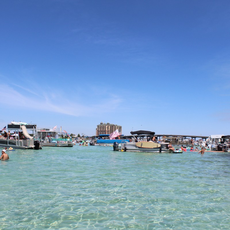 a group of people in a boat on a body of water