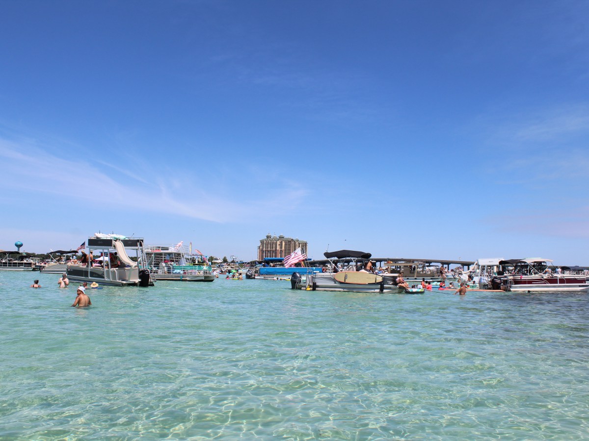 a group of people in a boat on a body of water