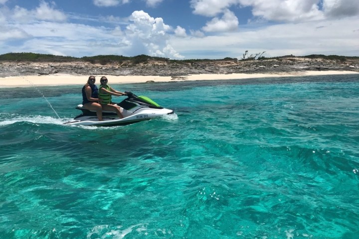 a person riding a surf board on a body of water