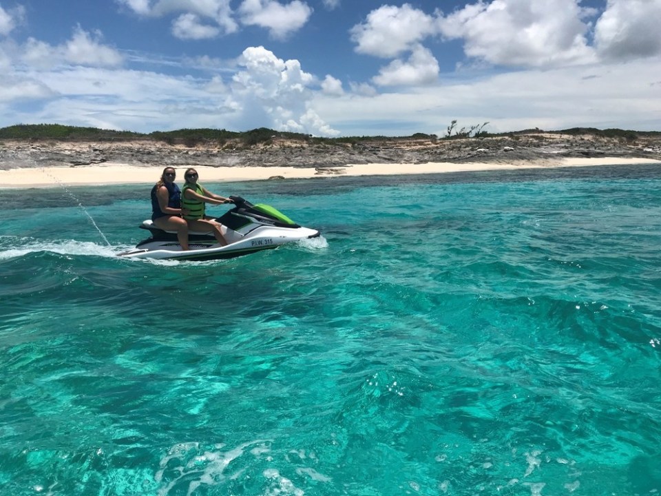 a person riding a surf board on a body of water