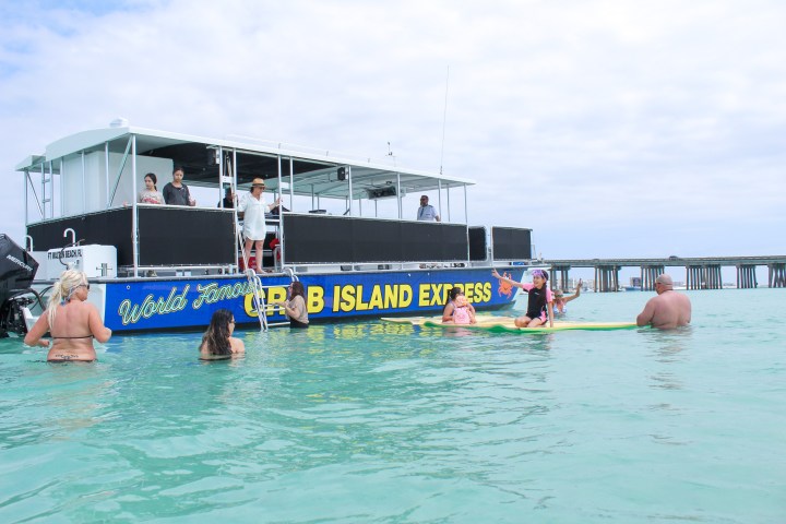 a group of people in a boat on a body of water